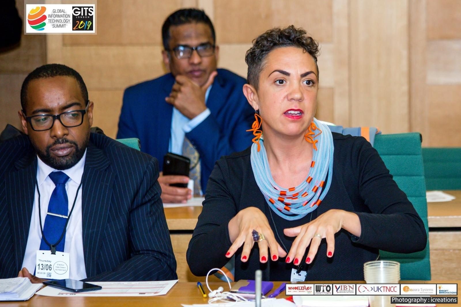 A woman contributing to a WTO technology panel in London